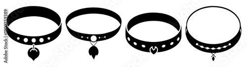 A set of four black chokers with various charms and studs on a white background