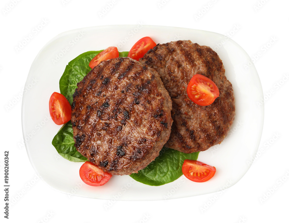Obraz premium Delicious grilled meat patties, tomatoes and spinach isolated on white, top view