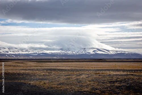 Hekla volcano landscape view of snowcapped mountain peak and lava field in Iceland
