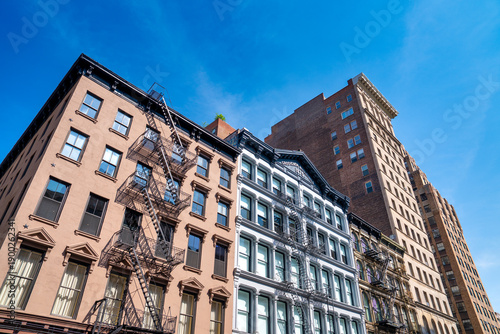 Billede på lærred New York City buildings with exterior fire escape stairs in Manhattan urban scen
