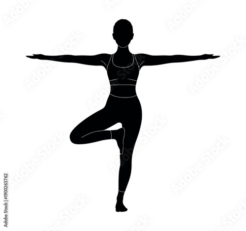 A woman in a yoga pose with her arms outstretched and one leg lifted in a serene and peaceful atmosphere.