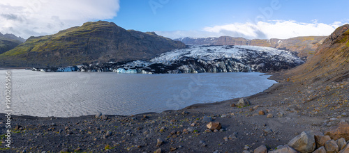 Solheimajokull glacier lagoon panorama with retreating ice cap and moraines, Iceland