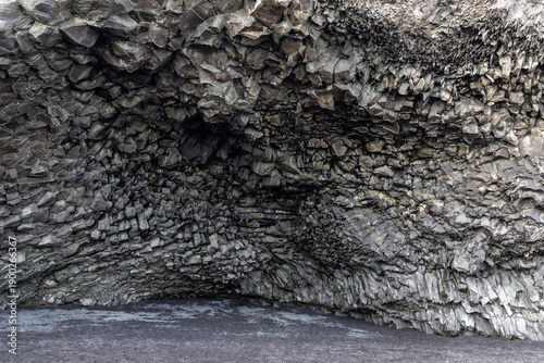 Halsanefshellir Cave basalt columns vault interior view at Reynisfjara Black Sand Beach, Iceland