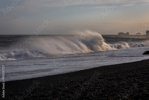 Dangerous sneaker waves crashing on Reynisfjara Black Sand Beach near Dyrholaey, Iceland