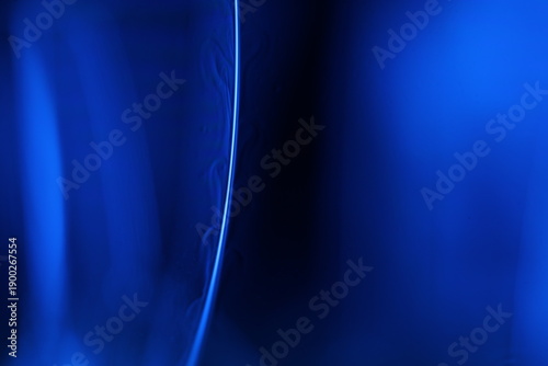Tablou pe pânză Abstract macro shot of blue liquid bubbles and a thin fluid thread