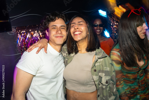 People having fun at a vibrant nightclub party