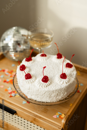 Sponge cake with cherries and cream cheese frosting