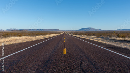 A long, straight road through the Chihuahuan Desert in southern Texas near Marfa