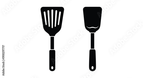 Two kitchen spatulas depicted in a stark black silhouette