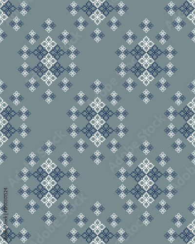 Seamless geometric folk pattern inspired by traditional embroidery. Symmetrical diamond motifs in soft blue and gray tones, ideal for textiles, wallpapers, backgrounds, and surface pattern design.