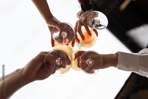 Cuadro en lienzo Friends toasting outdoor, low angle view to the sky, conviviality