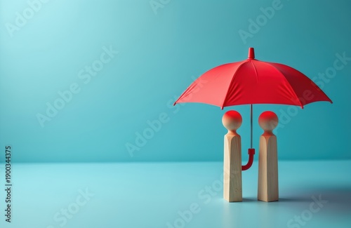 Wallpaper Mural Two wooden figures stand together under a red umbrella. This simple visual symbolizes protection, security, and mutual support, conveying concepts of insurance and care for people. Torontodigital.ca
