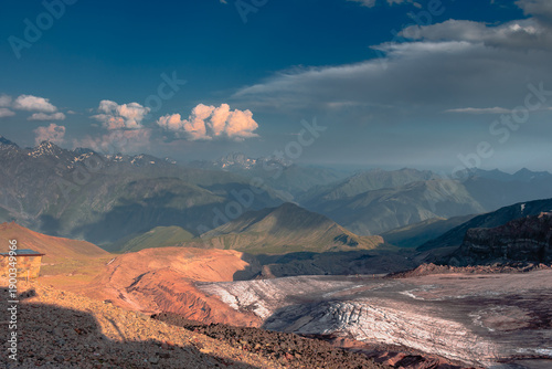 Panorama of caucasian Kazbegi mountain and architecture of ancient Georgia. drama sky, mountain peaks, high resolution photo.