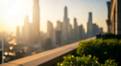 Golden hour sunrise casting a warm glow over a blurred city skyline, creating an abstract urban background view