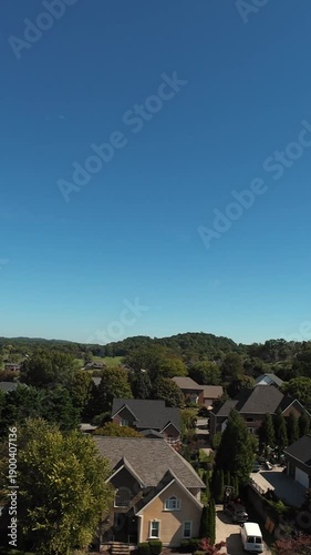 Wallpaper Mural Vertical Screen Aerial View Of Rooftops And Trees With Bright Midday Sun, Close Sweep Over Houses, Driveways And Manicured Lawns, Active Realty Drone Inspection, Rolling Hills On Horizon, Torontodigital.ca