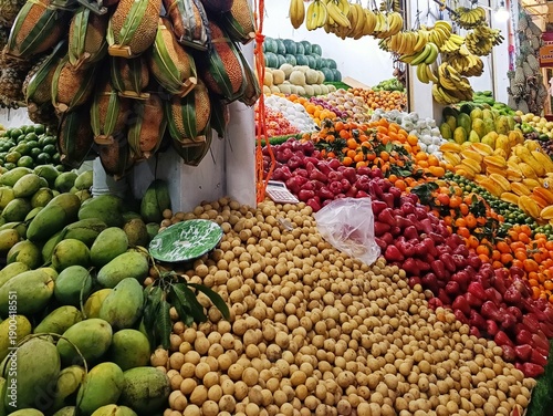 fruits store in the market with verity fruits like papaya, mango, banana, orange, and more