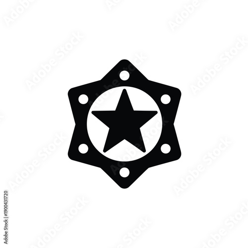 A black star shaped metal badge with holes for sewing or attachment