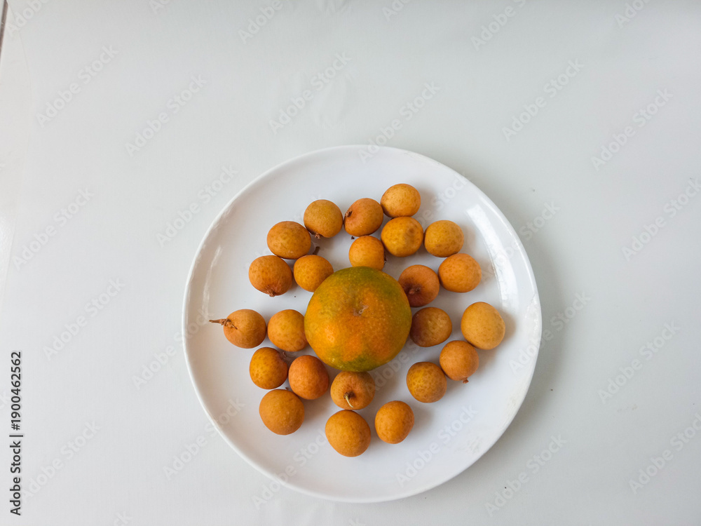 Fototapeta premium longan fruit on a plate isolate on white background