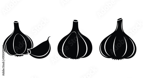 Three garlic bulbs and a clove in stark black silhouette