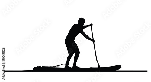 Man paddleboarding on calm water distinct black silhouette