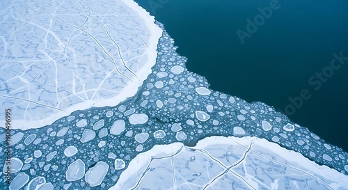 Aerial view of fragmented ice and dark water, abstract winter landscape