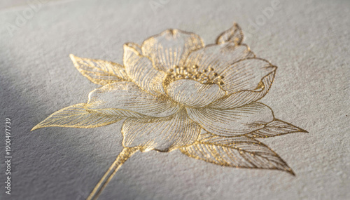 Elegant white and gold flower embroidery decoration. Beautiful handmade textile craft on light background showing delicate, gentle sophistication