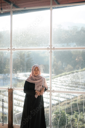 Free Download woman at the window of the house - GFXLoad