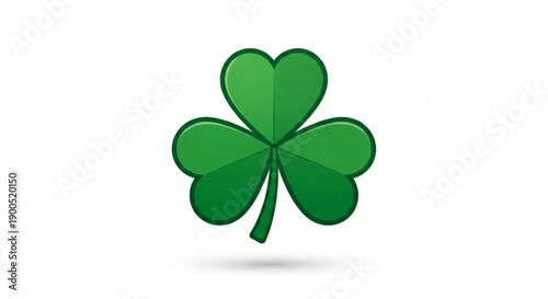 Lucky green four leaf clover on white background with subtle shadow symbolizing good fortune and irish heritage