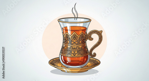 Steaming traditional turkish tea in ornate glass cup on saucer with golden pattern