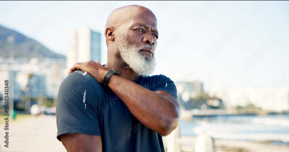 Fototapeta premium Senior man, fitness and promenade with shoulder pain for workout accident, strain or pressure. Active, elderly or black person with sore arm or injury for muscle tension, fibromyalgia or discomfort