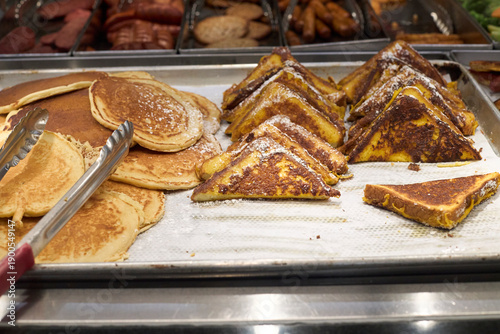 Pancakes and french toast. Breakfast foods on a buffet