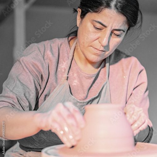 Wallpaper Mural Professional Female Potter Shaping Wet Clay on Rotating Pottery Wheel Torontodigital.ca