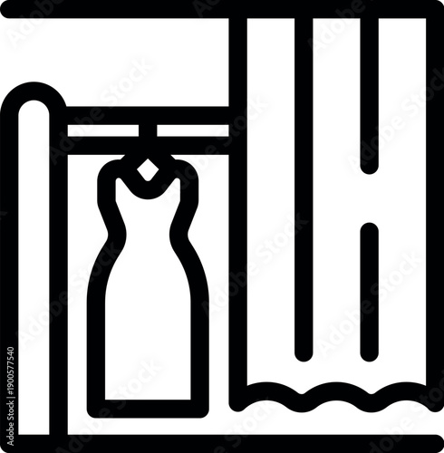 Elegant dress hanging in a fitting room, offering privacy with a drawn curtain, perfect for trying on clothes before purchase