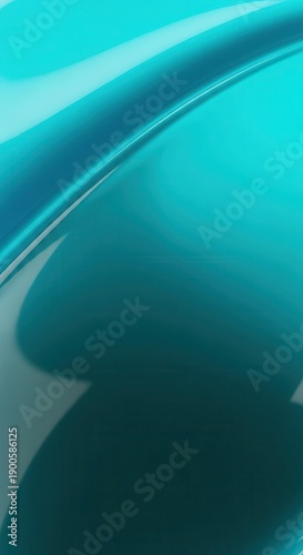 Smooth, curving, glossy surface displays striking variations in teal and deep turquoise color