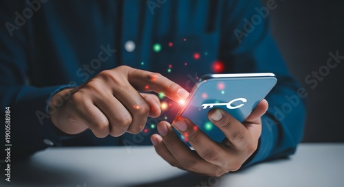 A person holding a smartphone with a car key on the screen