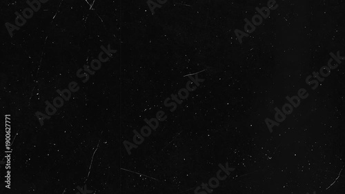 Dark background with fine white dust and subtle scratches