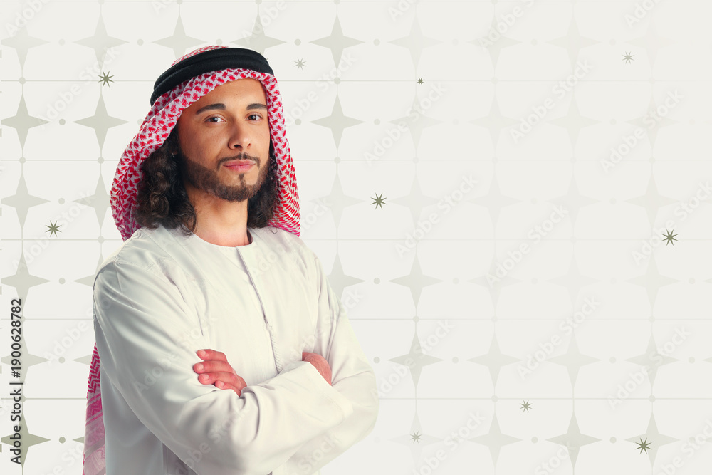 Fototapeta premium Muslim man in traditional dress during Ramadan celebrations in a decorated setting