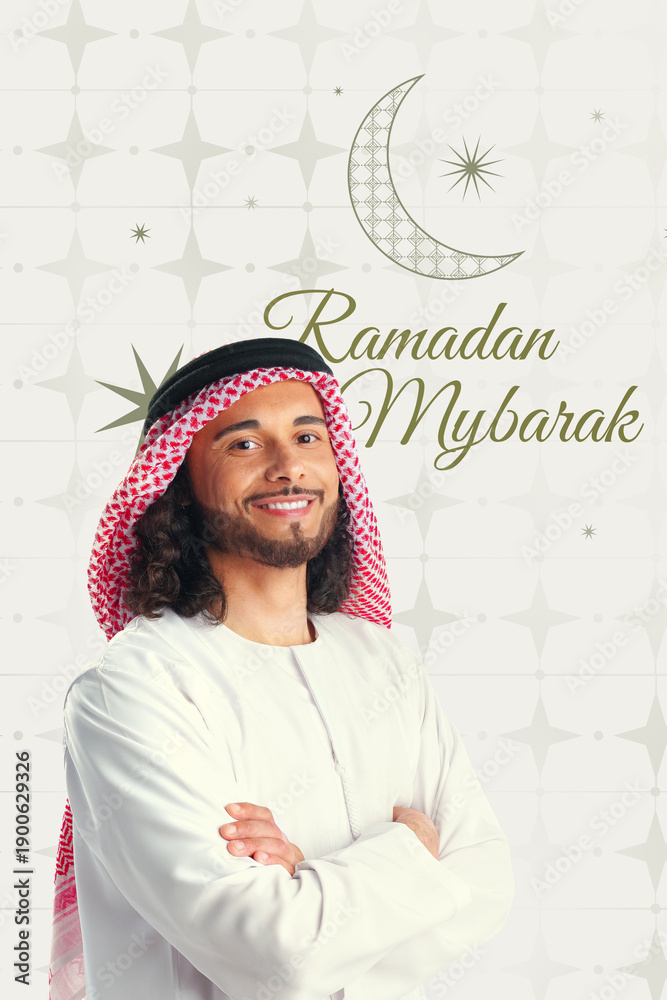 Naklejka premium Young man smiling and celebrating the month of Ramadan with a traditional outfit