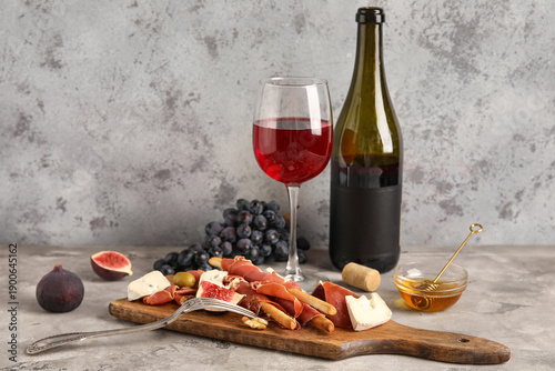 Board with tasty jamon slic...