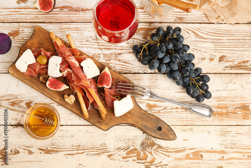 Board with tasty jamon slic...