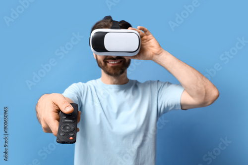 Young man in VR glasses wit...