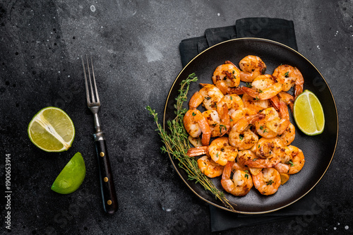 Photography Grilled spicy Shrimps Prawns with garlic and lime in a plate