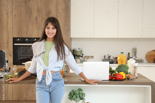 Young woman near table with...