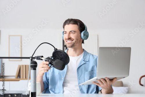 Male radio presenter with l...