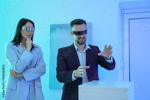 Young couple with VR glasse...