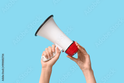 Female hands with megaphone...