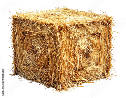 A compact, square bale of golden straw, fully illuminated against black