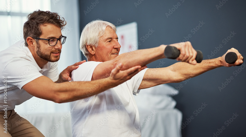 Obraz premium Clinic, physiotherapist and old man with dumbbells, training and assistance for fitness and wellness. Active, senior person and physical therapy with equipment for health, exercise or rehabilitation