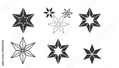 A collection of black and white star shapes on a plain background