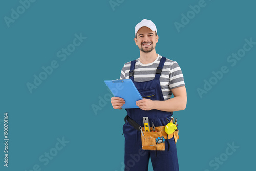Male technician with clipbo...
